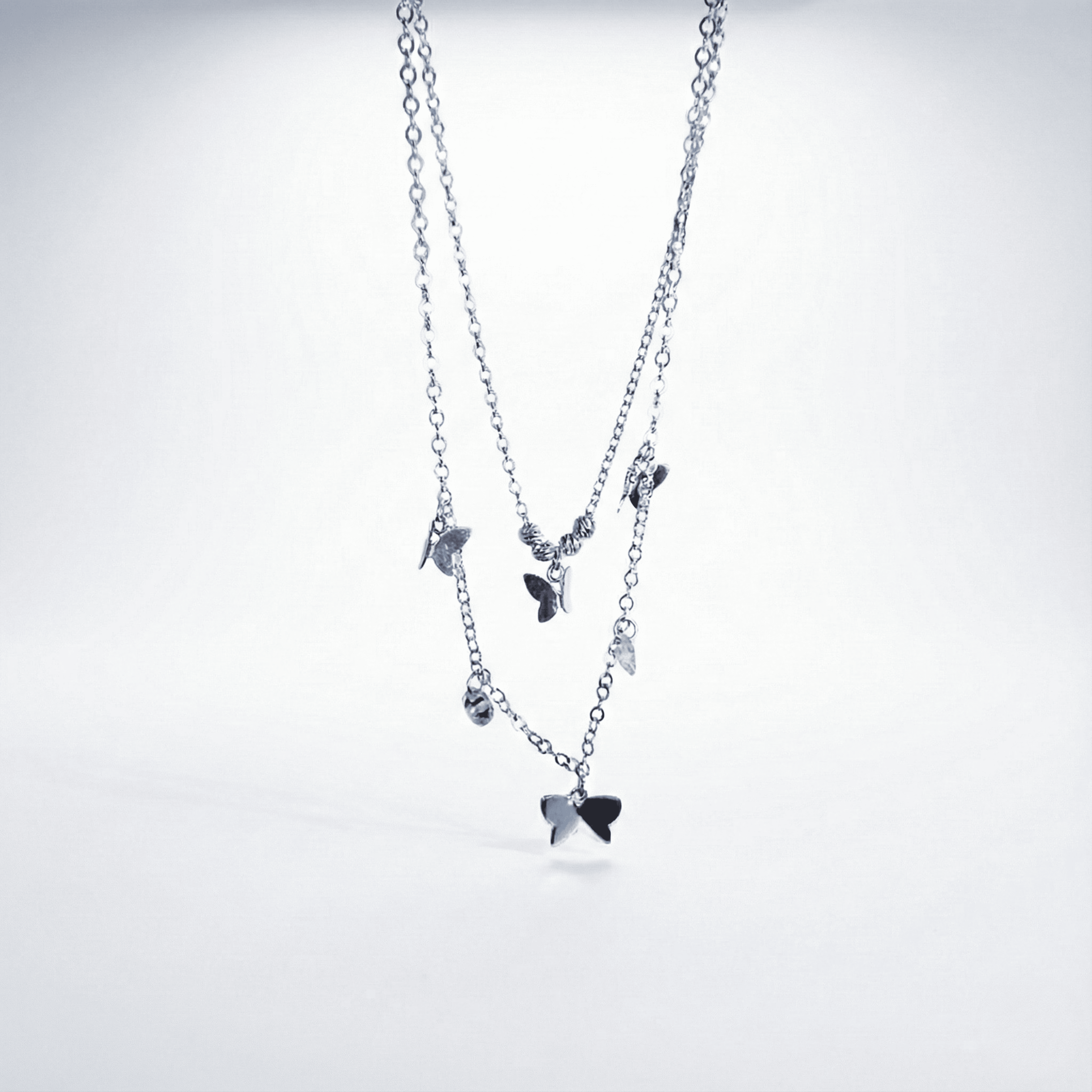 Collar doblemariposas y cristal