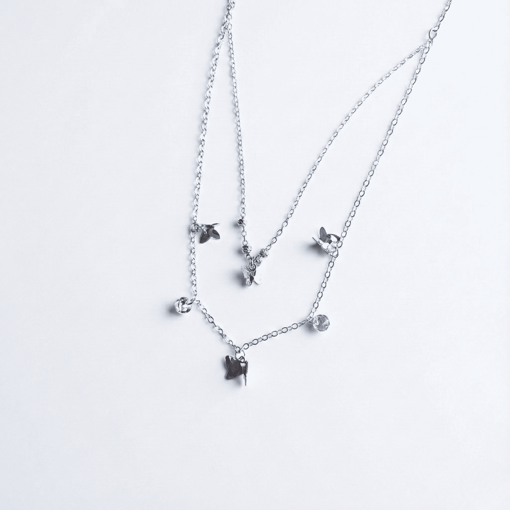 Collar doblemariposas y cristal