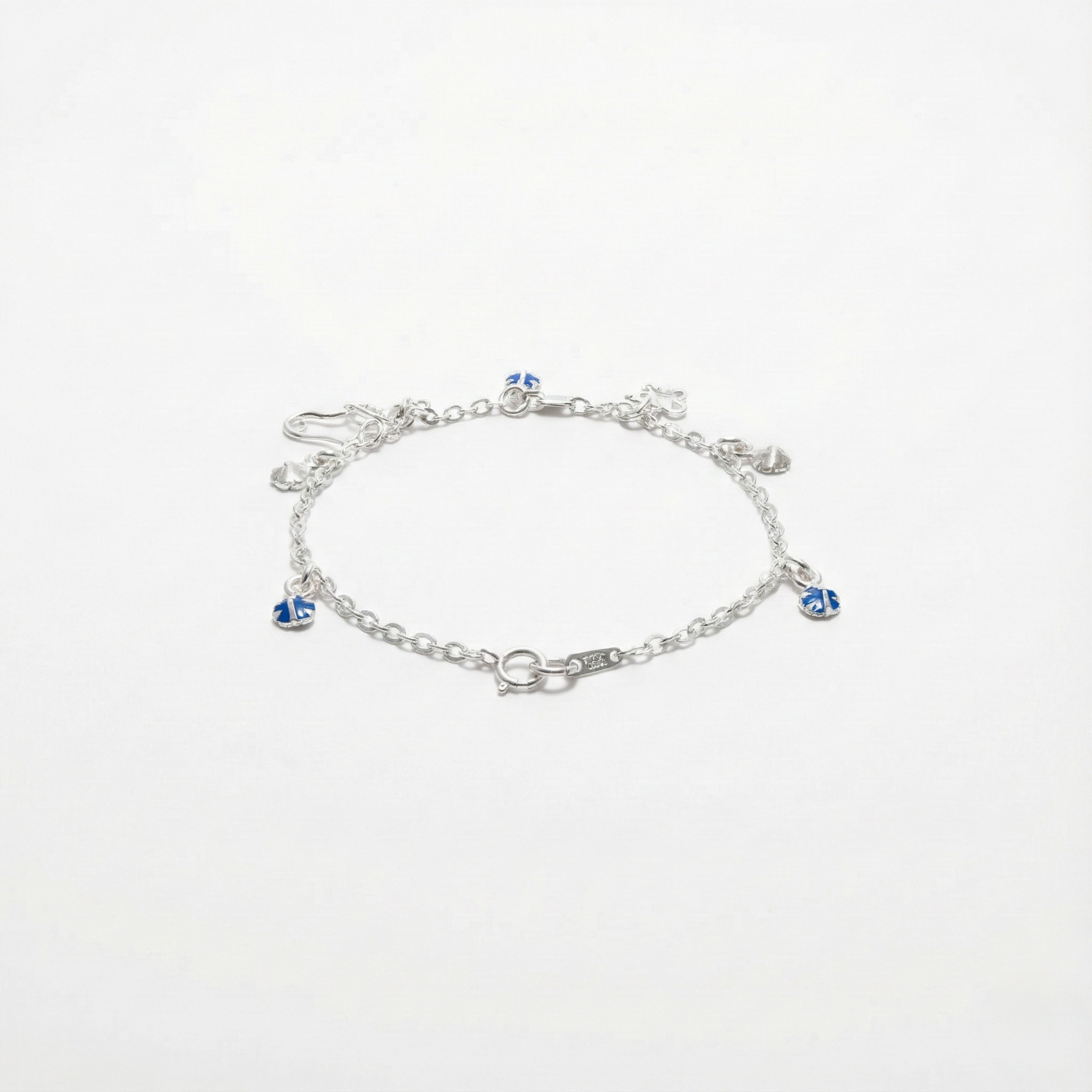 Pulsera navideña con Charms de Bota, Oso y Destellos Zafiro