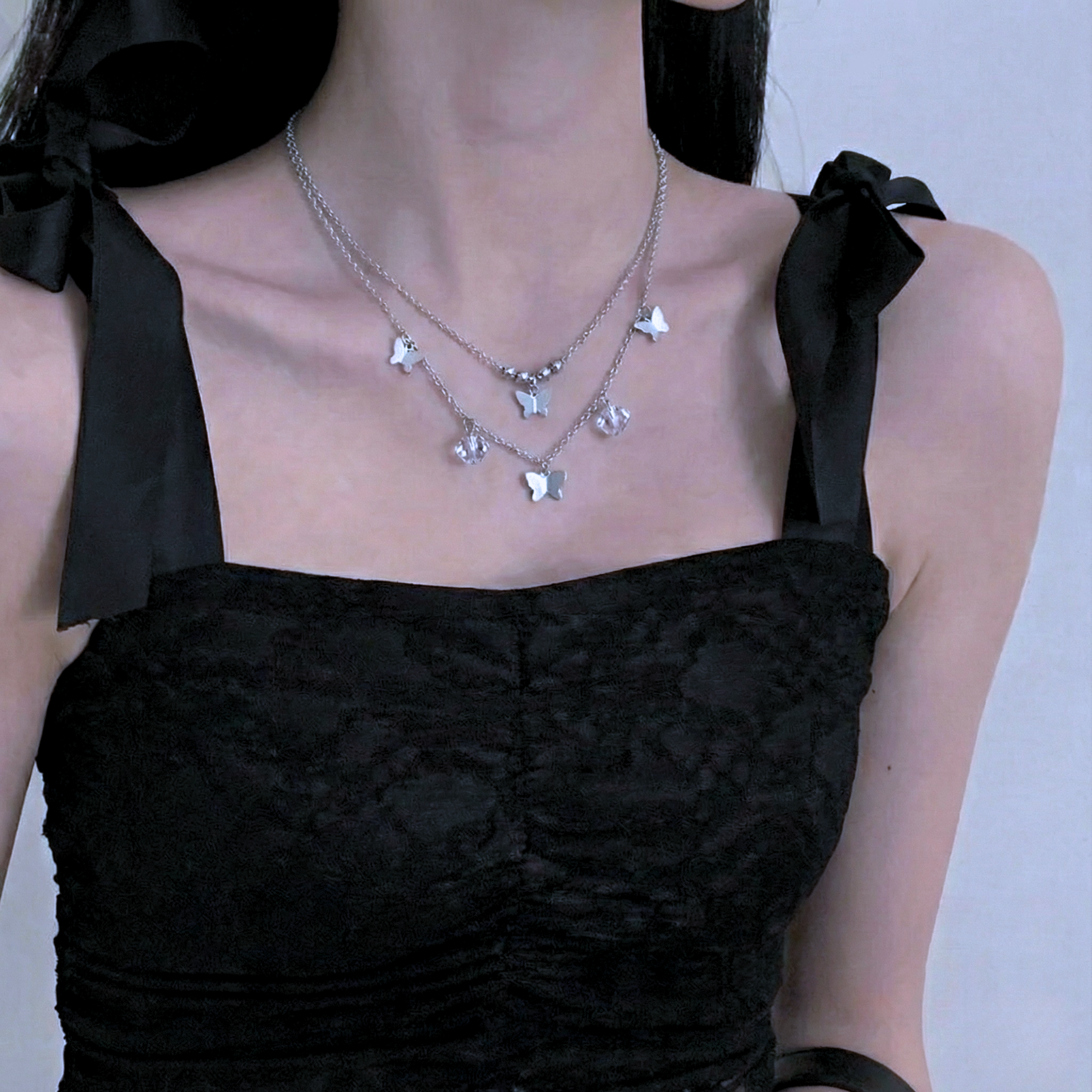 Collar doblemariposas y cristal